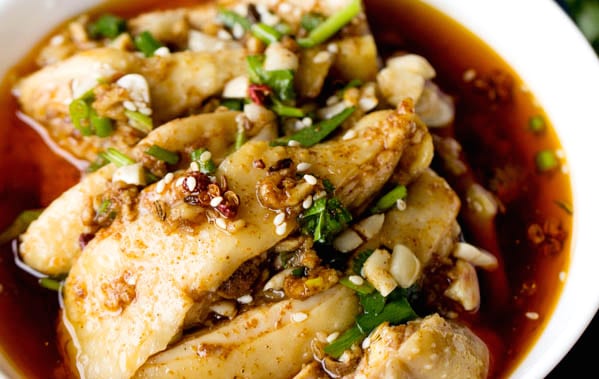 a bowl of sliced white chicken in red Si Chuan styled mala flavour sauce. The succulent skin is tender and delicious.